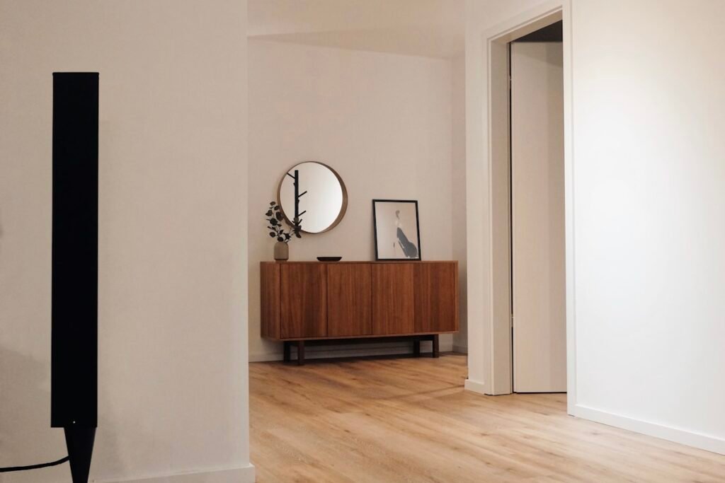 Professional basement wall finishing with moisture-resistant drywall installation in a Boston home renovation